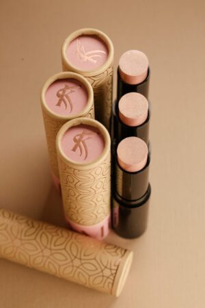 A close up of three tubes of lipstick