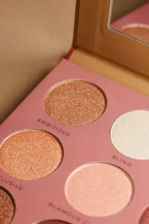 A box of makeup with four different shades