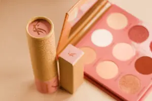 A close up of two cosmetics products on a table